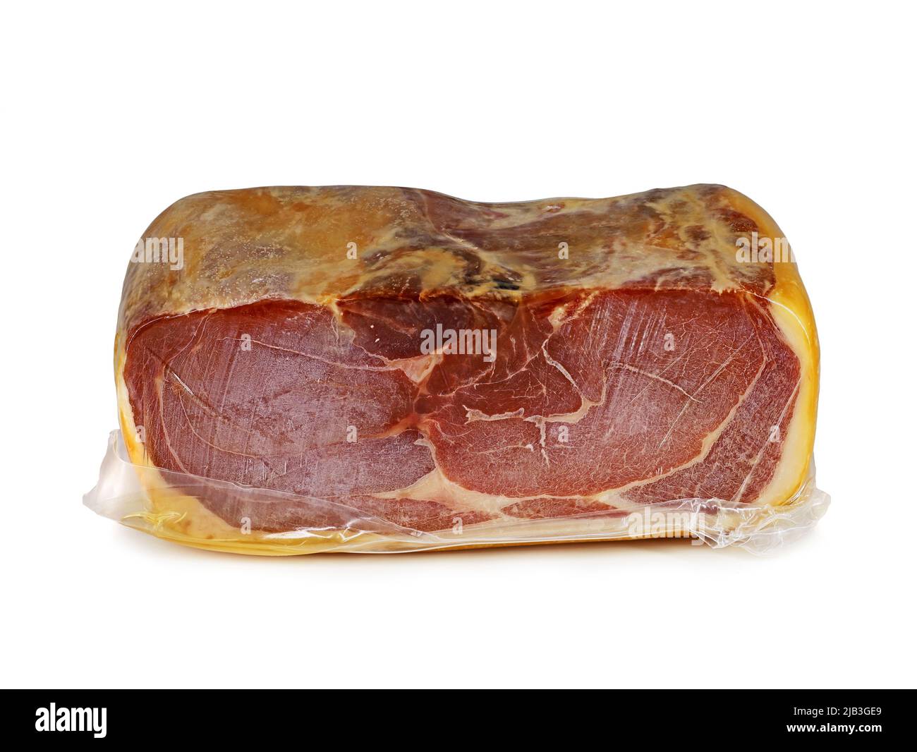 whole piece of serrano ham from Spain vacuum packed in plastic isolated on white background. Stock Photo