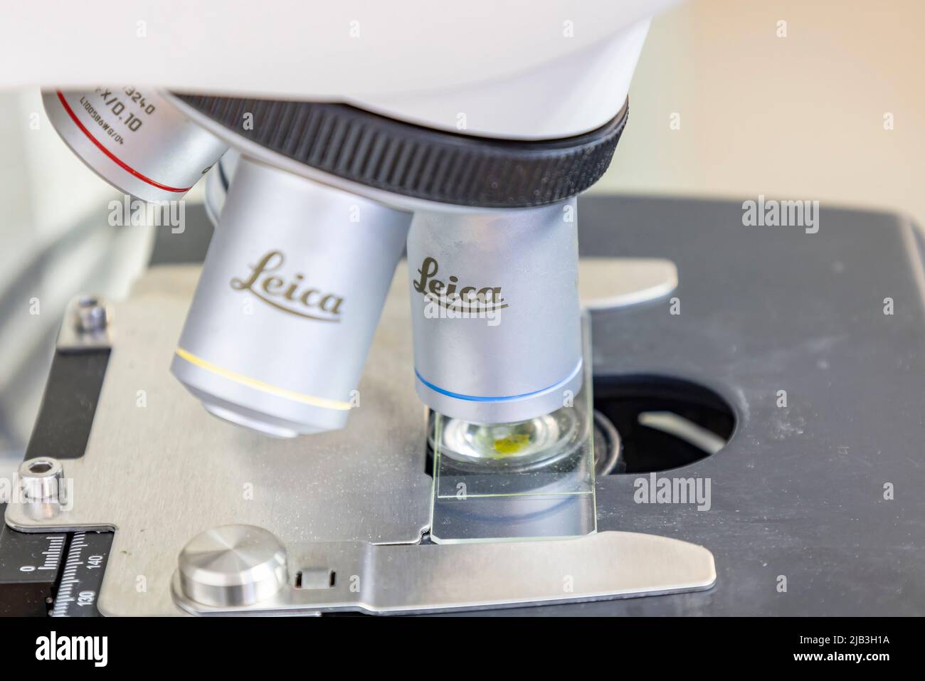 Huelva, Spain - April 28, 2022: Detail of a microscope from Leica Microsystems GmbH, a German manufacturing of optical microscopes Stock Photo