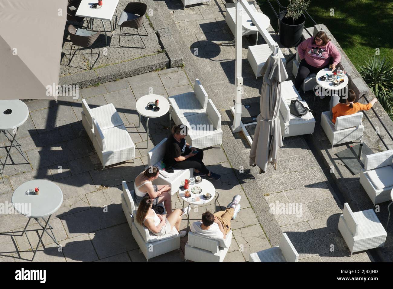 Aerial view on people sitting in restaurant in areal of Trsat castle in port of Rijeka. Stock Photo