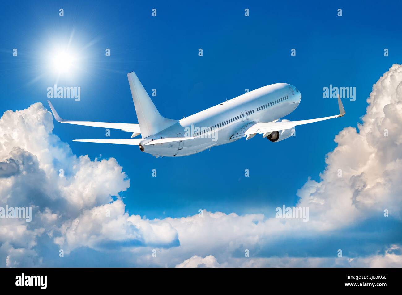 White passenger airplane is climbing in the air above picturesque ...