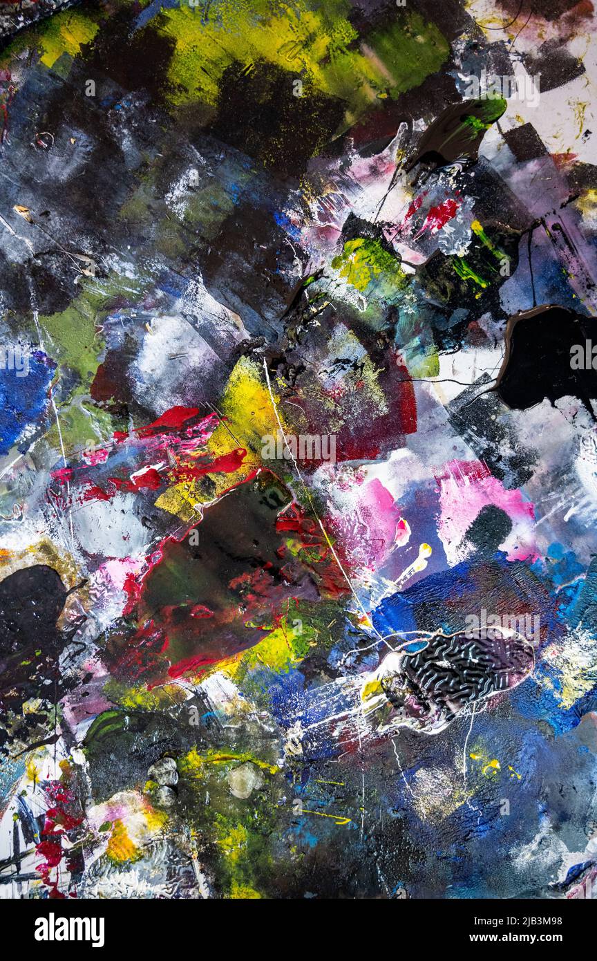 artist's palette of colorful oil paint for drawing and painting. view