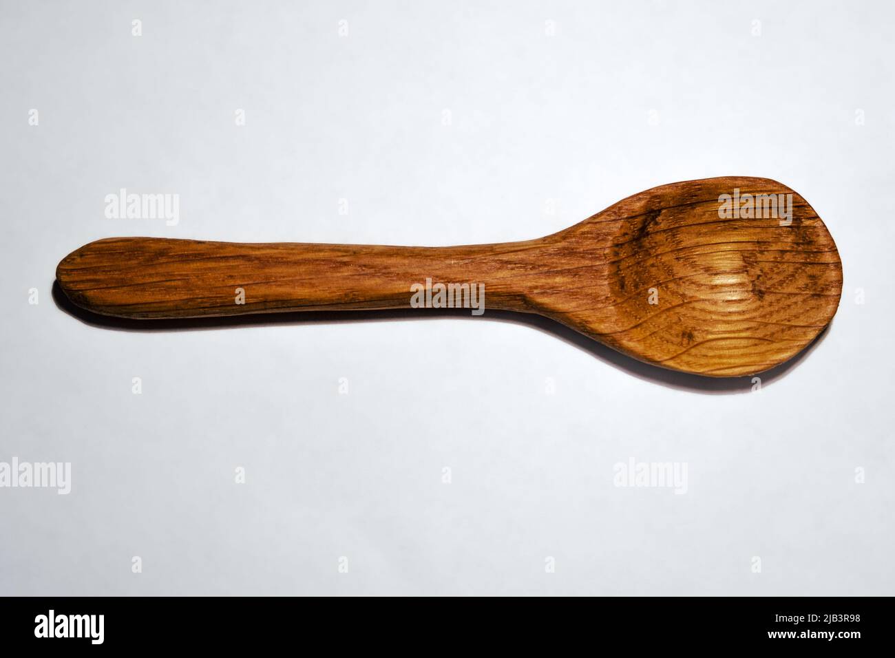 Handcarved wooden spoon Stock Photo