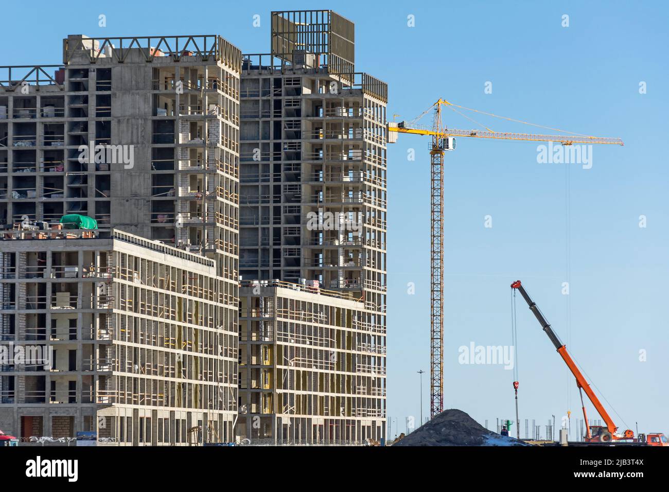 Construction of a residential building and cranes, real estate Stock