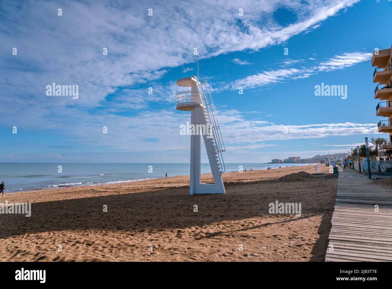White lifeguard tower at beach in Torrevieja, off season, Spain Stock Photo