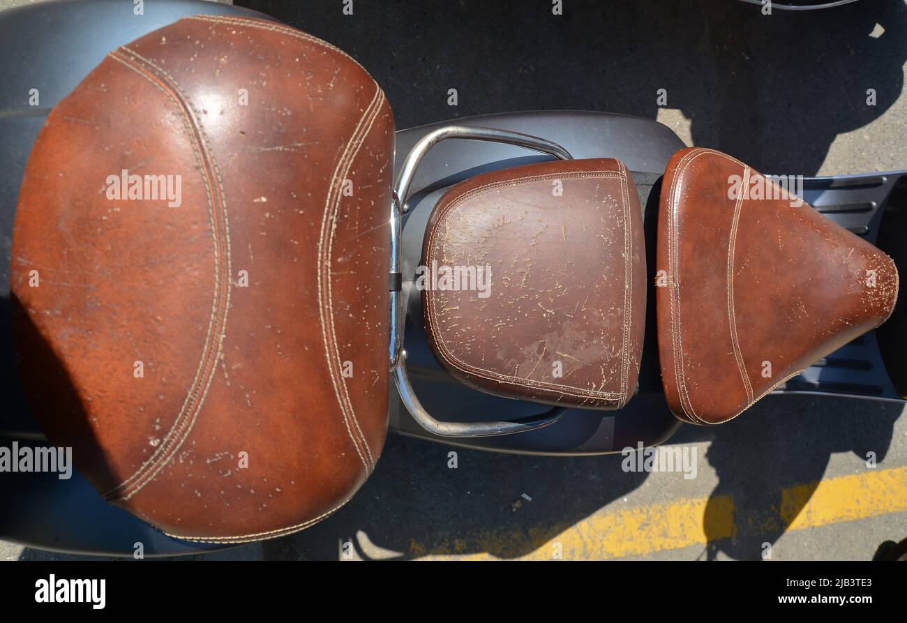 leather motorcycle seat scratched by cats and the damage they do Stock Photo Alamy