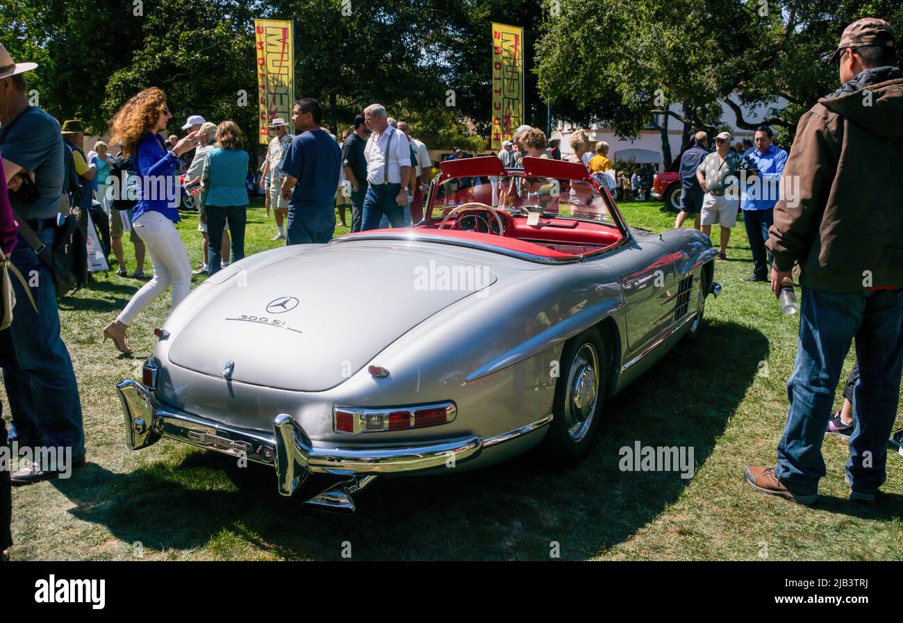 Spectators enjoy a classic Mercedes in downtown Carmel, seen at the Carmel-by-the-Sea Concours on the Avenue event during Monterey Car Week Stock Photo