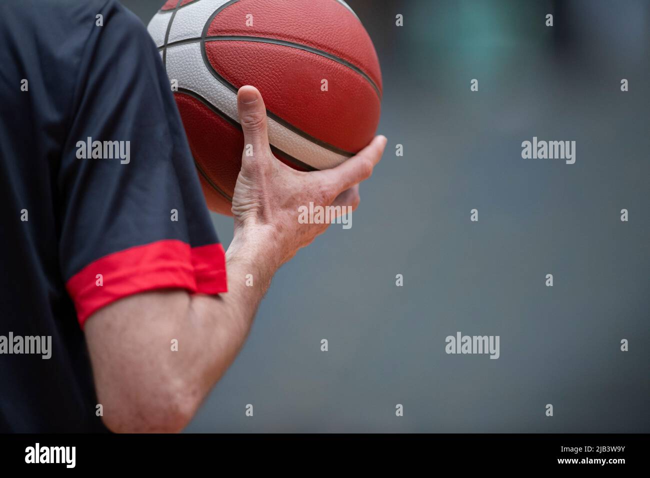 Basketball referee holding a basketball ball. Horizontal sport theme poster, greeting cards, headers, website and app Stock Photo