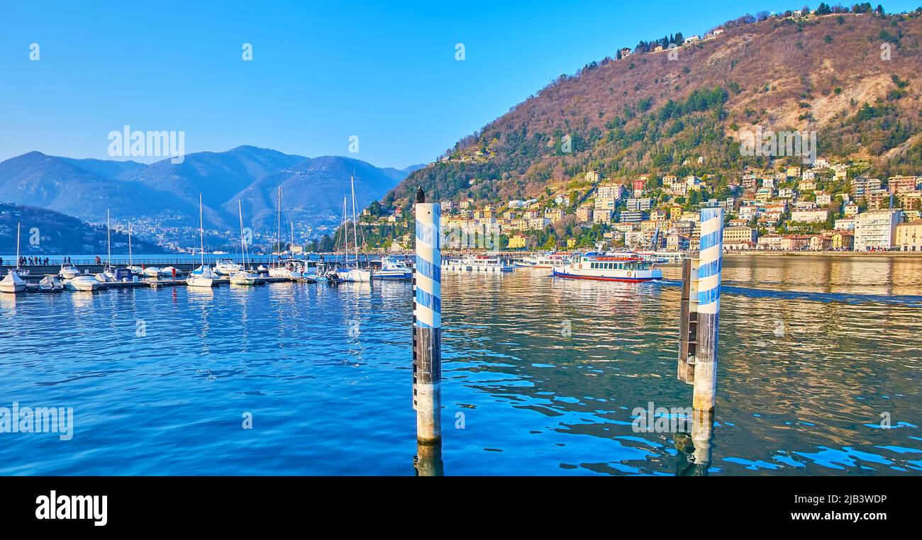 Panorama of Lake Como, port with boats and yachts, Piero Foranea Caldirola Dam and Monte Boletto in background, Como, Lombardy, Italy Stock Photo