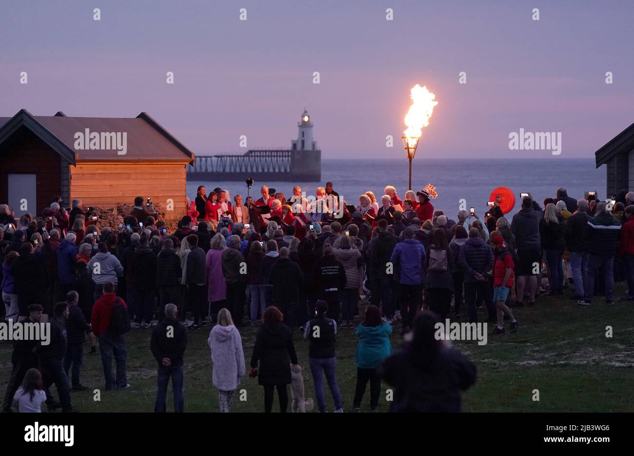 A Platinum Jubilee beacon is lit on Blyth beach, Northumberland, on day