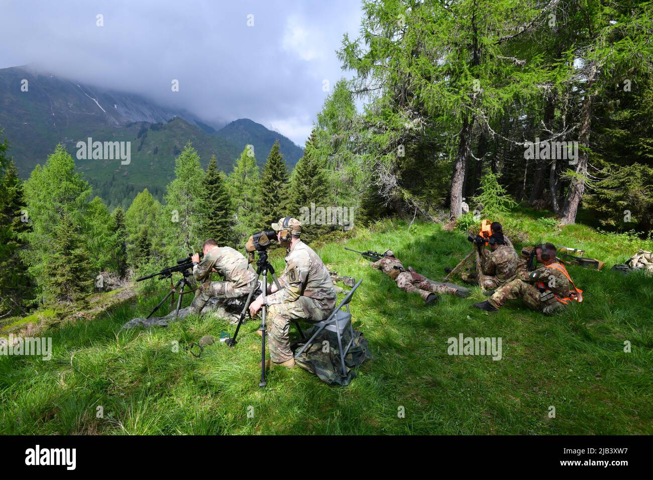U.S. Army paratroopers assigned to 1st Squadron, 91st Cavalry Regiment, 173rd Airborne Brigade, engage targets with M110 Semi-Automatic Sniper System during a live-fire exercise as part of Exercise Frozen Dart 22 at Monte Bivera Range in Casera Razzo, Italy, June 01, 2022. Exercise Frozen Dart 22 is a bilateral training exercise between 173rd Airborne Brigade and Italian Army 5th Alpine Regiment Vipiteno, 'Julia' Alpine Brigade. The 173rd Airborne Brigade is the U.S. Army's Contingency Response Force in Europe, providing rapidly deployable forces to the United States European, African, and Cen Stock Photo