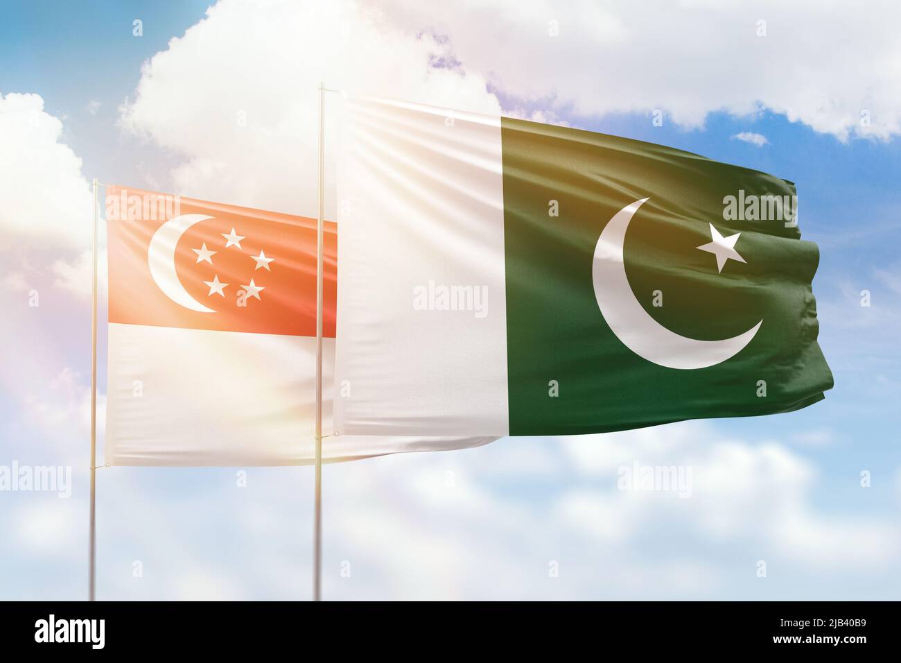 Sunny blue sky and flags of pakistan and singapore Stock Photo - Alamy