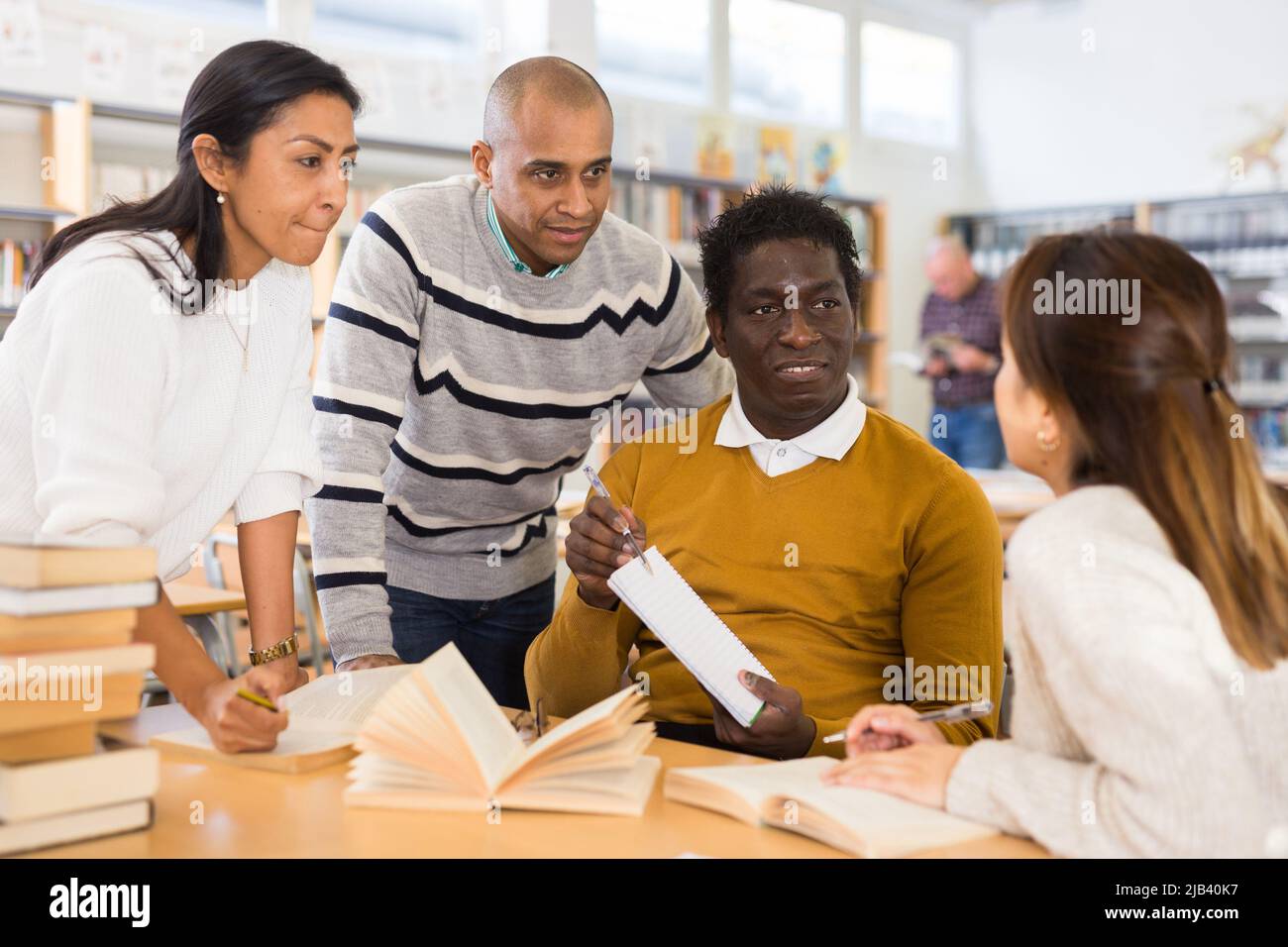 Group of adult people studying in library stock photo alamy