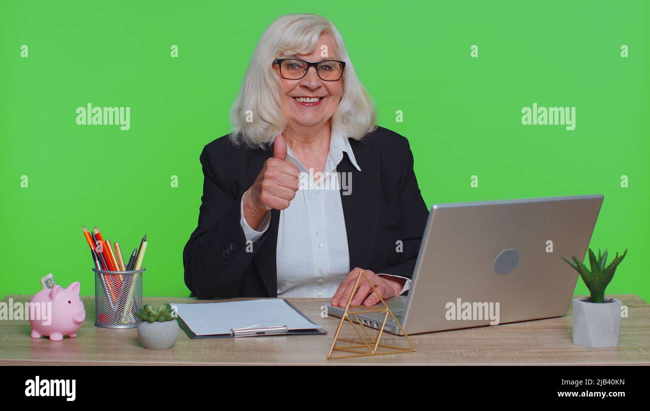 Senior woman raises thumbs up hi-res stock photography and images - Alamy