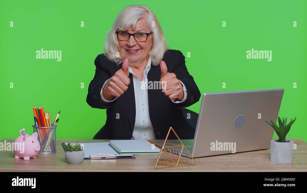 Senior woman raises thumbs up hi-res stock photography and images - Alamy