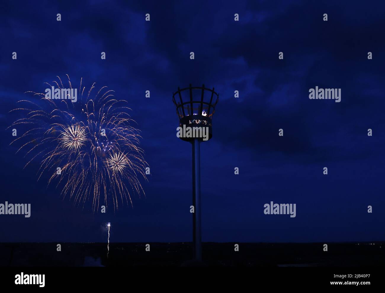 Mountsorrel, Leicestershire, UK. 2nd June 2022. Fireworks explode behind the beacon on Castle Hill during Platinum Jubilee celebrations. Thousands of beacons have been lit throughout regions of the UK to mark Queen Elizabeth IIÕs 70th year on the throne. Credit Darren Staples/Alamy Live News. Stock Photo