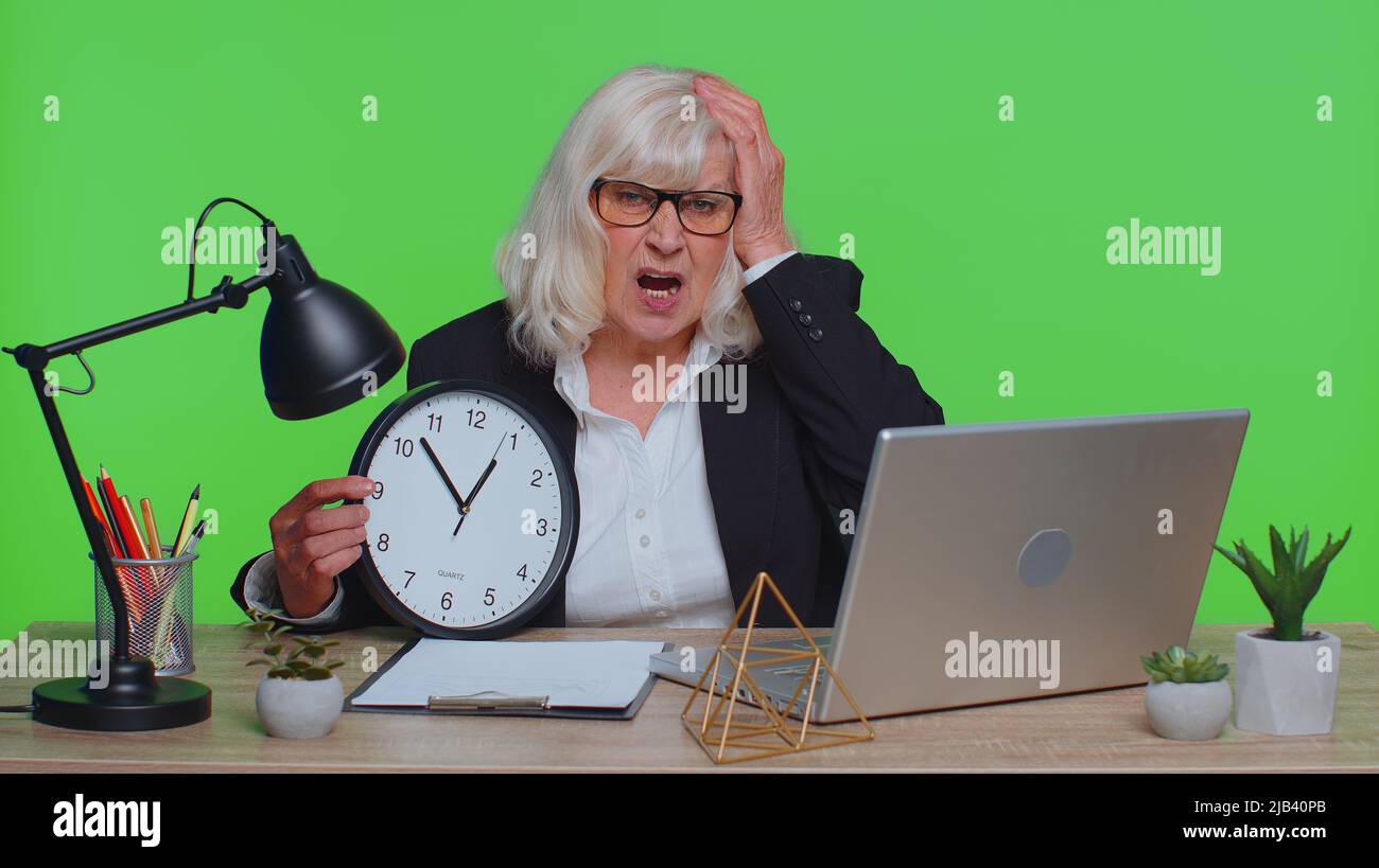 Scared mature businesswoman worrying punctual hi-res stock photography ...