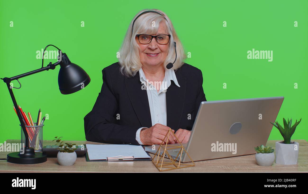 mature-woman-headset-laptop-webcam-hi-res-stock-photography-and-images