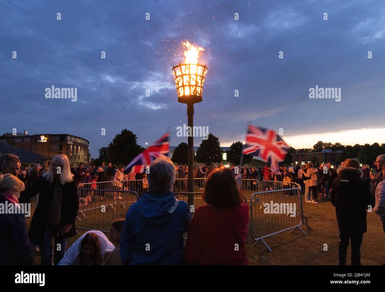 Queen Elizabeth Platinum Jubilee celebrations -  70th Jubilee beacon burning, Union Jack flag waving, Newmarket Suffolk UK 2nd June 2022 Stock Photo
