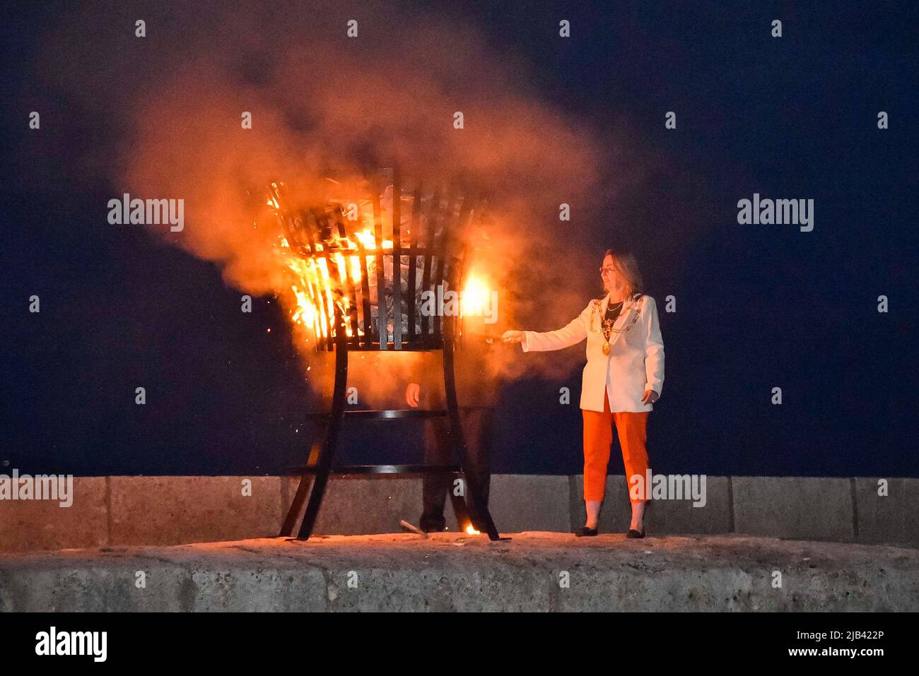 Lyme Regis, Dorset, UK. 2nd June 2022. Torchlight parade and beacon