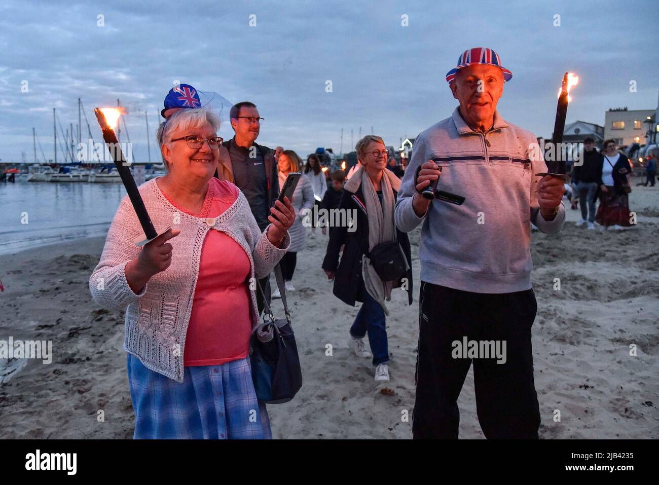 Lyme Regis, Dorset, UK. 2nd June 2022. Torchlight parade and beacon
