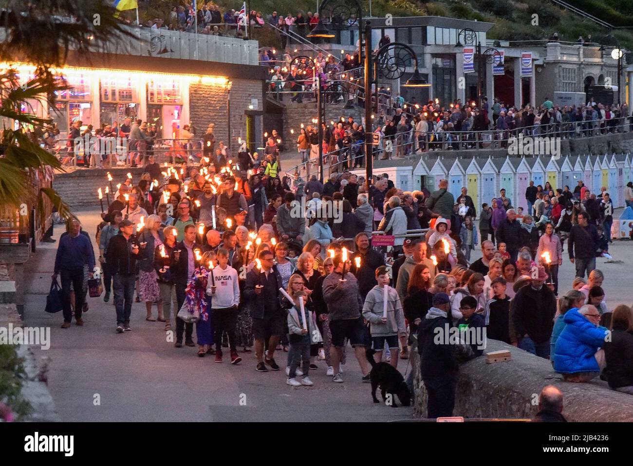 Lyme Regis, Dorset, UK. 2nd June 2022. Torchlight parade and beacon