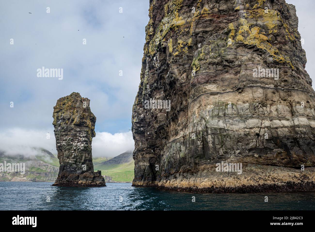 Litli Drangur cliff og Drangarnir rock formation on Vagar Island seen ...