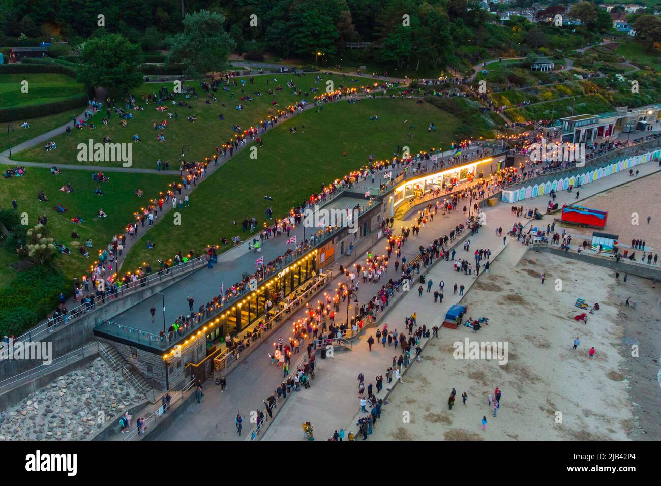 Lyme Regis, Dorset, UK. 2nd June 2022. Torchlight parade and beacon