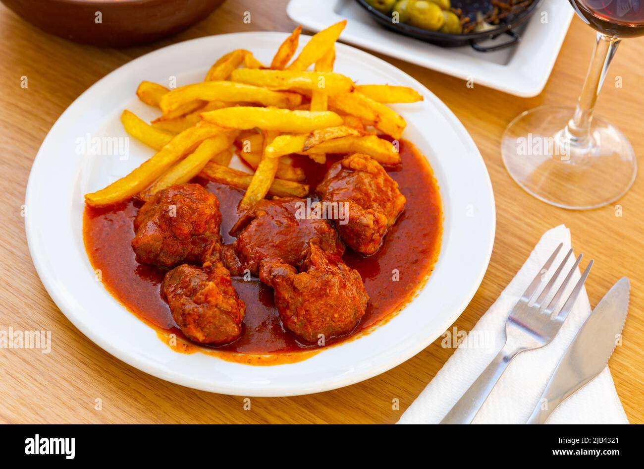 Baked chicken fillet with french fries sauce Stock Photo - Alamy
