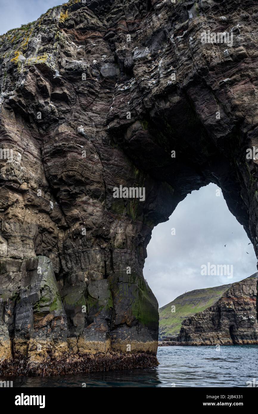Arch of Stori Drangur of Drangarnir rock formation on Vagar Island seen