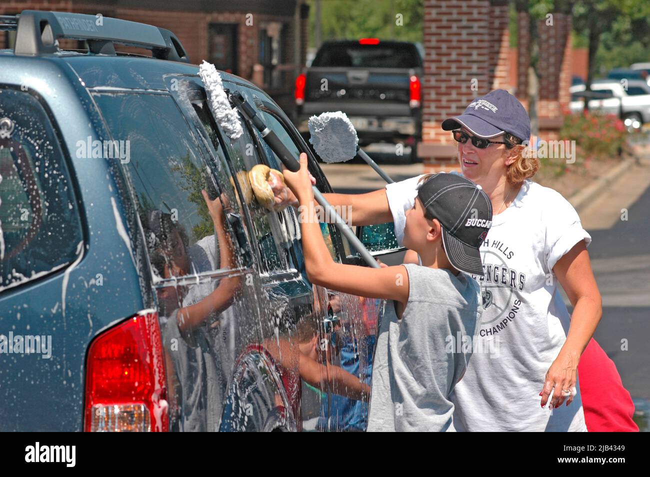 Teen Atlanta Christian church group has a donation car wash to help victims of Katrina Hurricane in LA Gulf Coast of USA Stock Photo