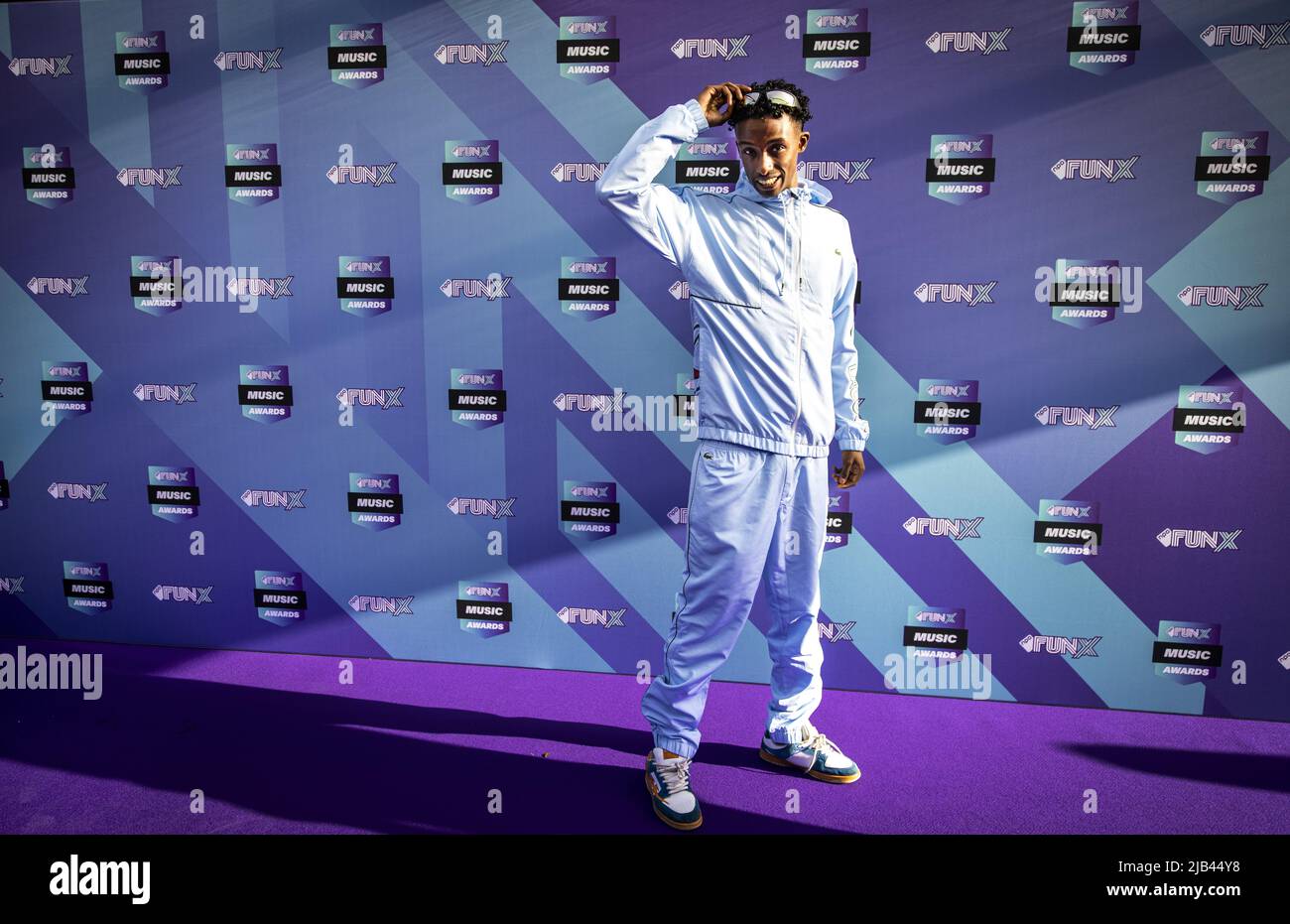 2022-06-02 19:31:53 AMSTERDAM - Appie Musa on the purple carpet for the FunX Music Awards in AFAS Live in Amsterdam. During the award show, the most important music prizes of the young Netherlands are presented. ANP RAMON VAN FLYMEN netherlands out - belgium out Stock Photo