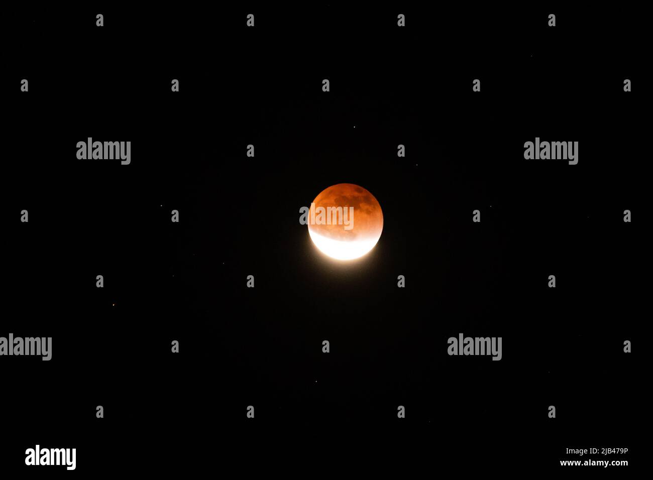 Red moon during total Lunar Eclipse in May 2022 Stock Photo