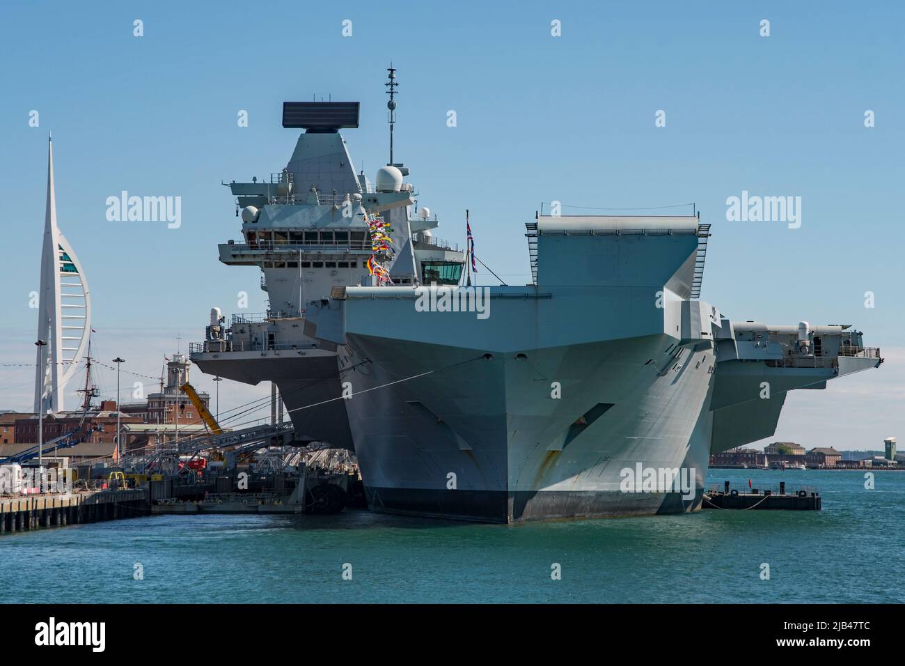 HMS Queen Elizabeth dressed overall for the Queen's Platinum Jubilee. Seen alongside at Portsmouth Naval Base, UK on Coronation Day the 2nd June 2022. Stock Photo