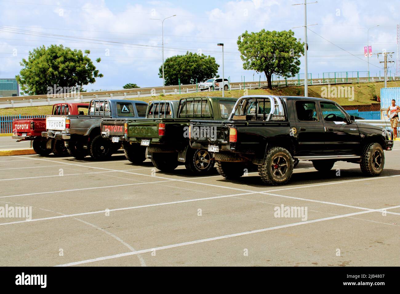 Old model Toyota Hilux trucks lined up at the Waigani SNS parking lot in Port Moresby in 2021 Stock Photo