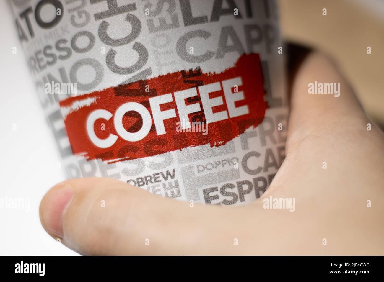 Hand-held coffee cup Stock Photo