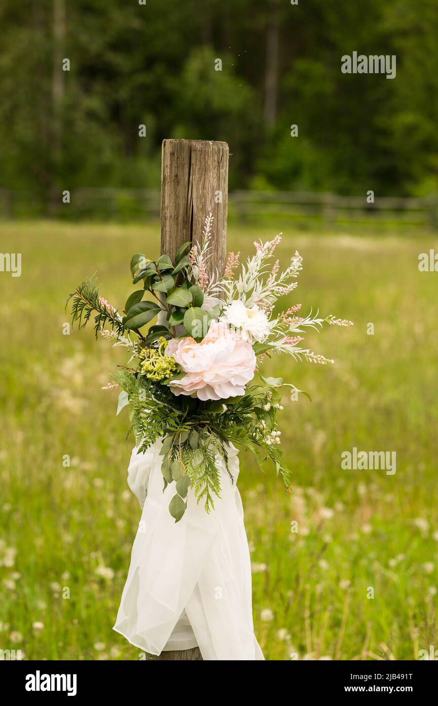 Wedding decorations and flowers in a farmers field.  Pemberton BC, Canada. Stock Photo