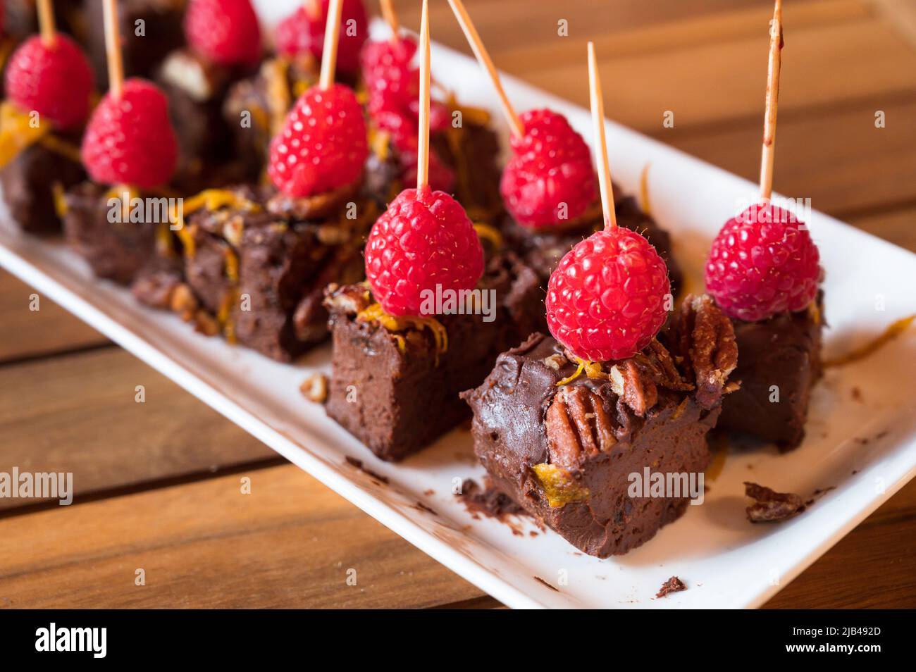 Fudge brownie and raspberry hors d'oeuvres, or appetizers. Stock Photo