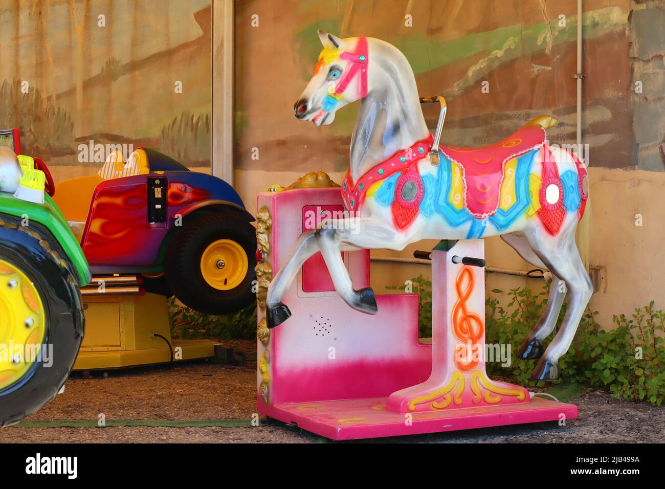 Coin operated amusement kiddie rides Stock Photo Alamy