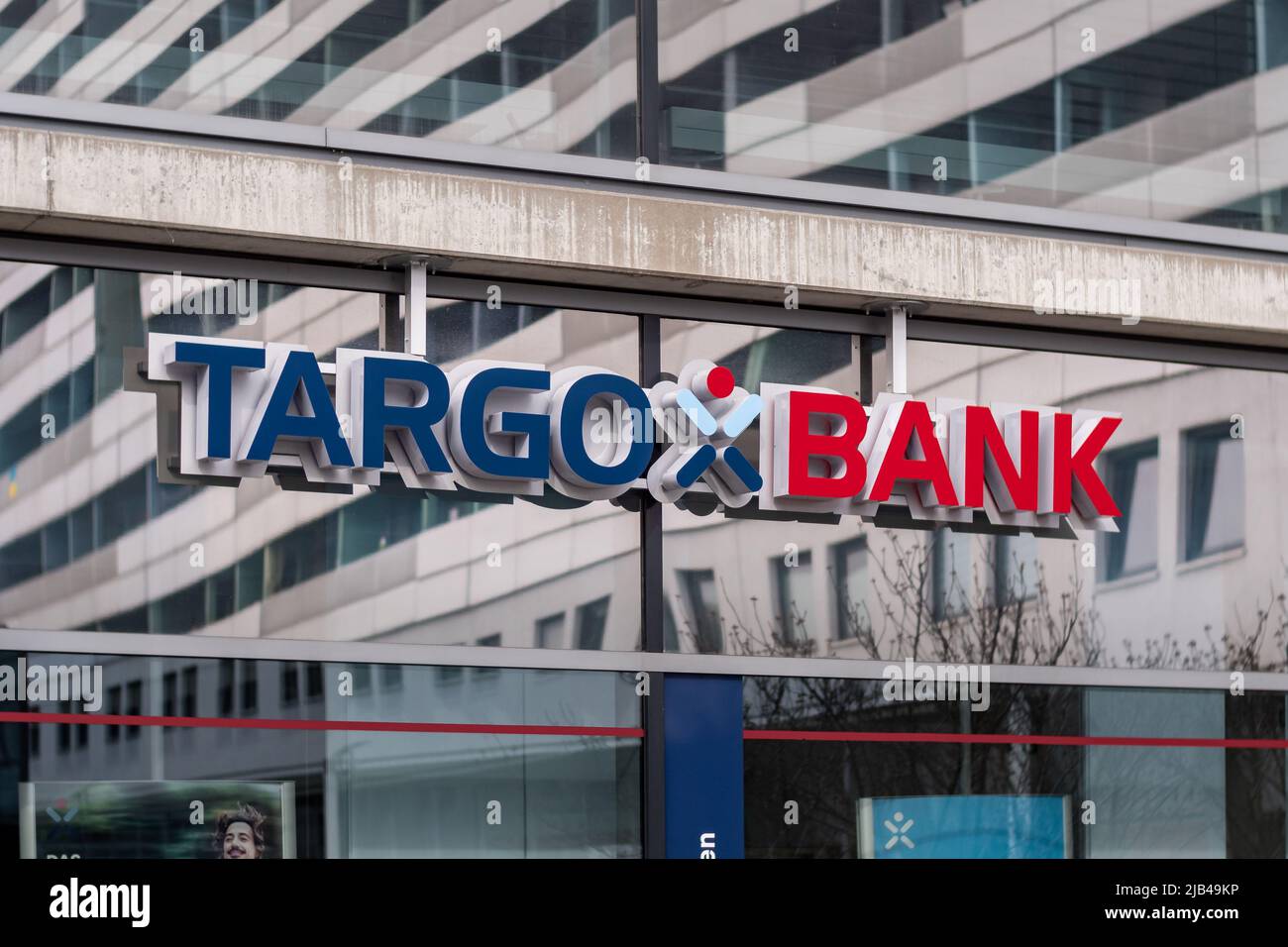 Targobank logo on a building exterior in the city. The windows on the facade are reflecting the surrounding architecture. Banking service in Europe. Stock Photo