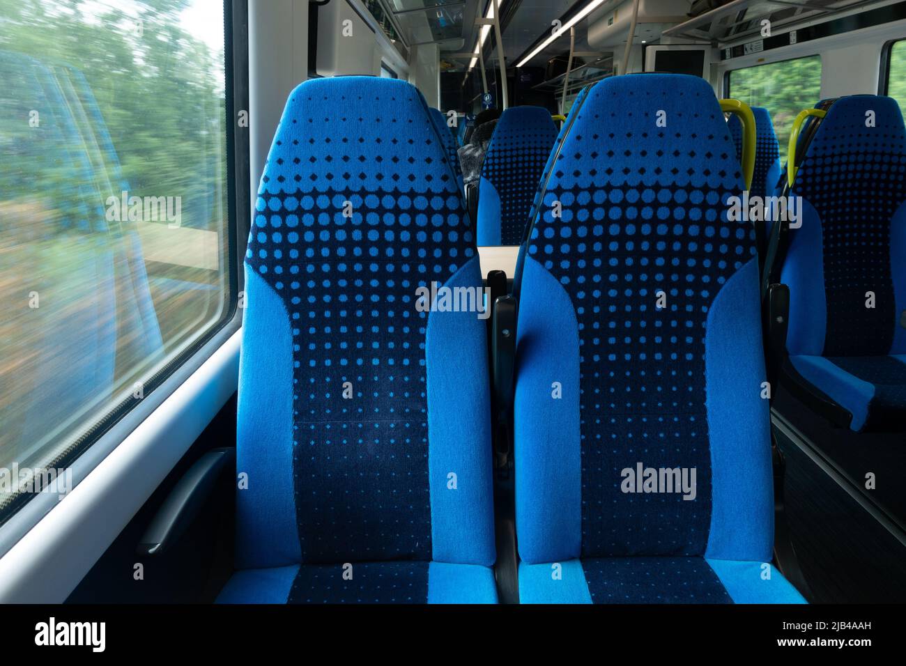 two empty train seats side by side Stock Photo Alamy