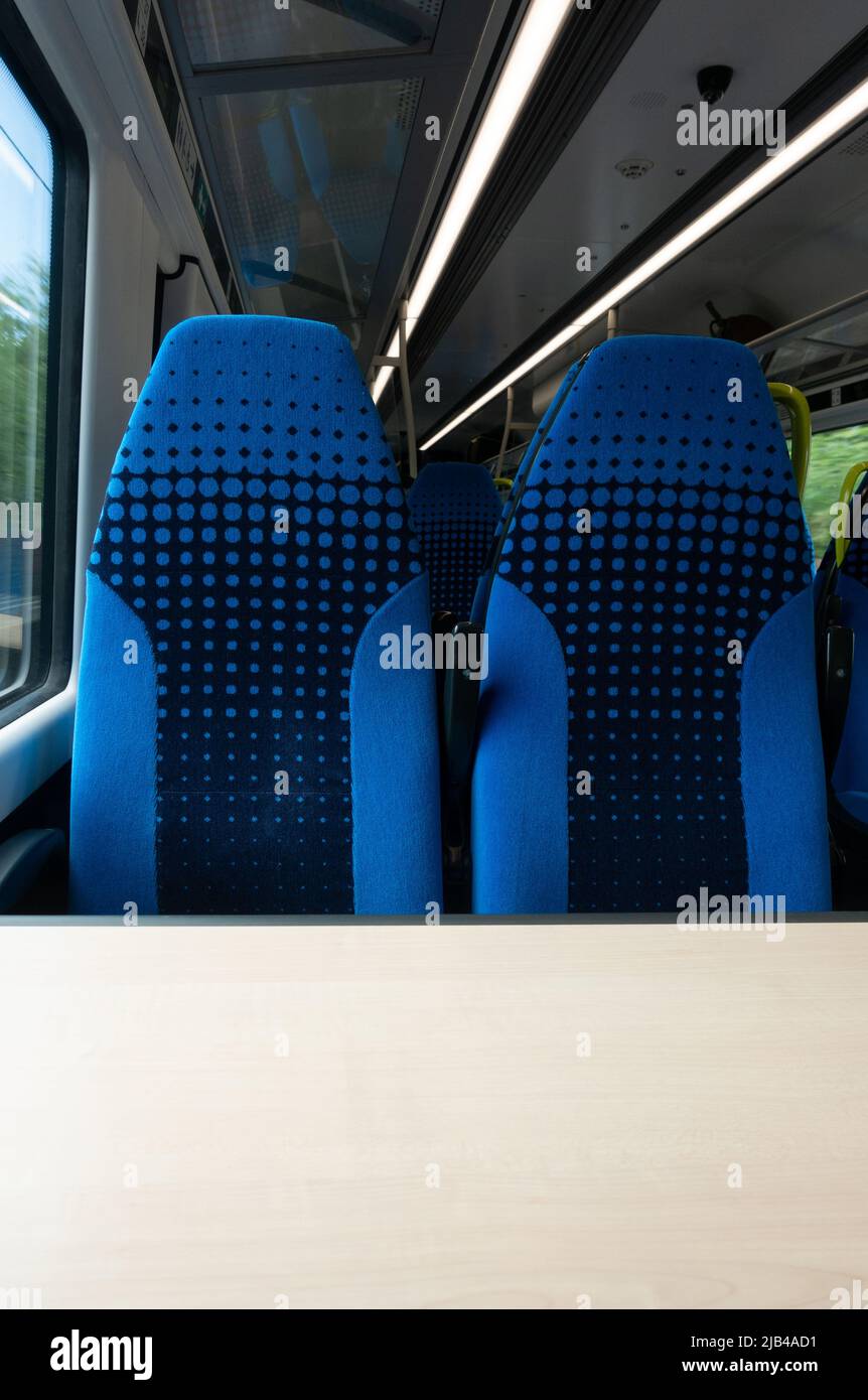 two empty train seats side by side Stock Photo