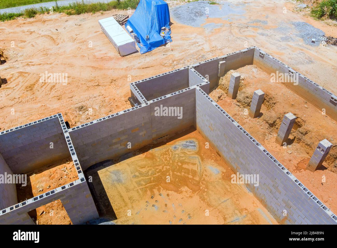 Construction mason concrete blocks foundation for new house building an