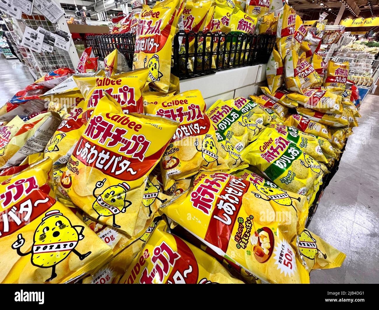 Calbee potato chips snack on display at Trial Supermarket in Fukuoka, Japan. Calbee is one of Japan's biggest snack makers. Stock Photo
