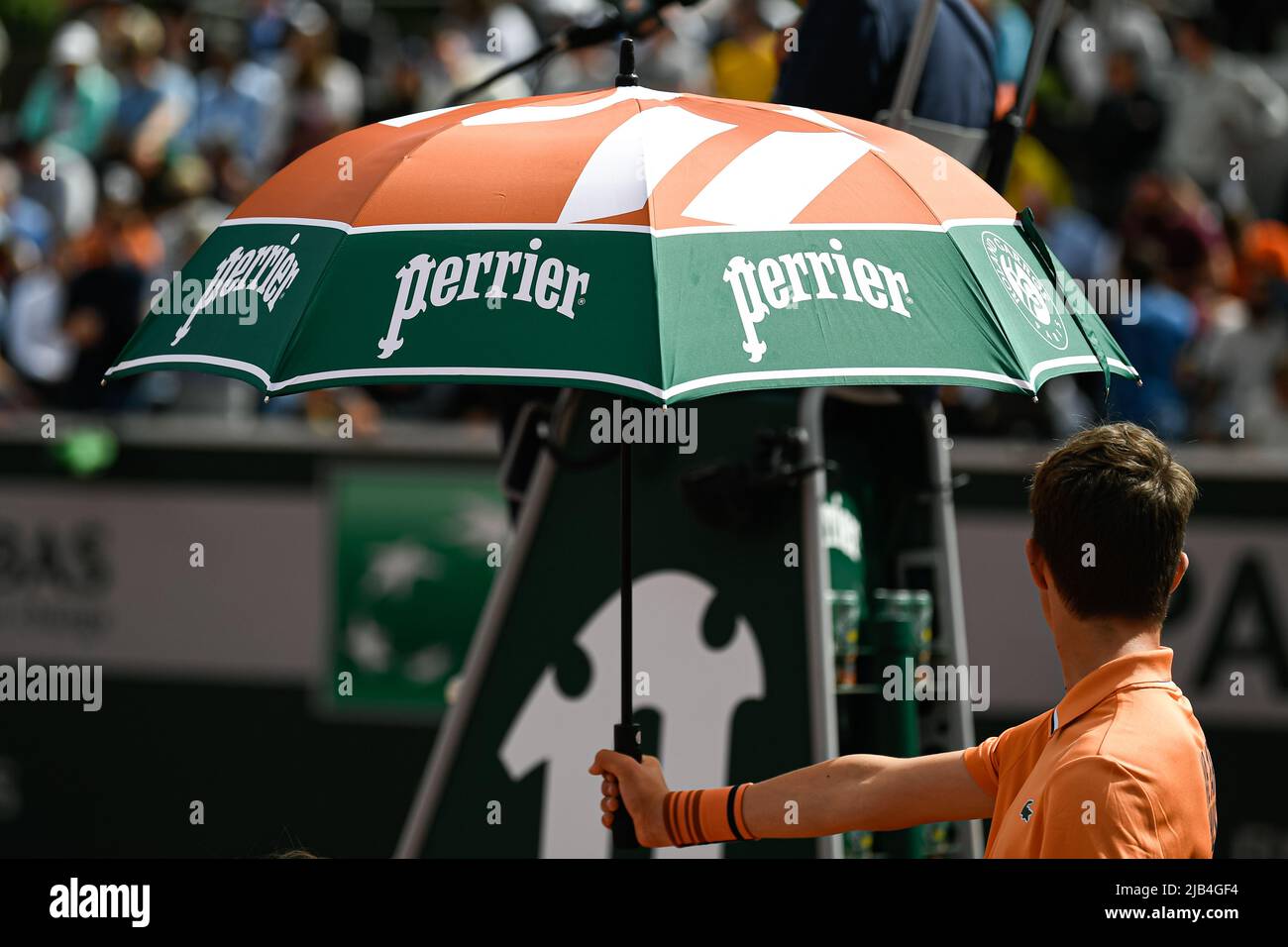 Illustration picture shows the umbrella or parasol held by a ball kid over  a player because of the heat during the French Open, Grand Slam tennis  tournament on May 24, 2022 at