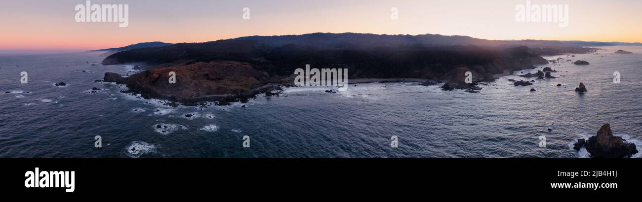 Cape Ferrelo and Lone Ranch Beach in Brookings, Oregon. Aerial Panorama at sunrise.  Stock Photo