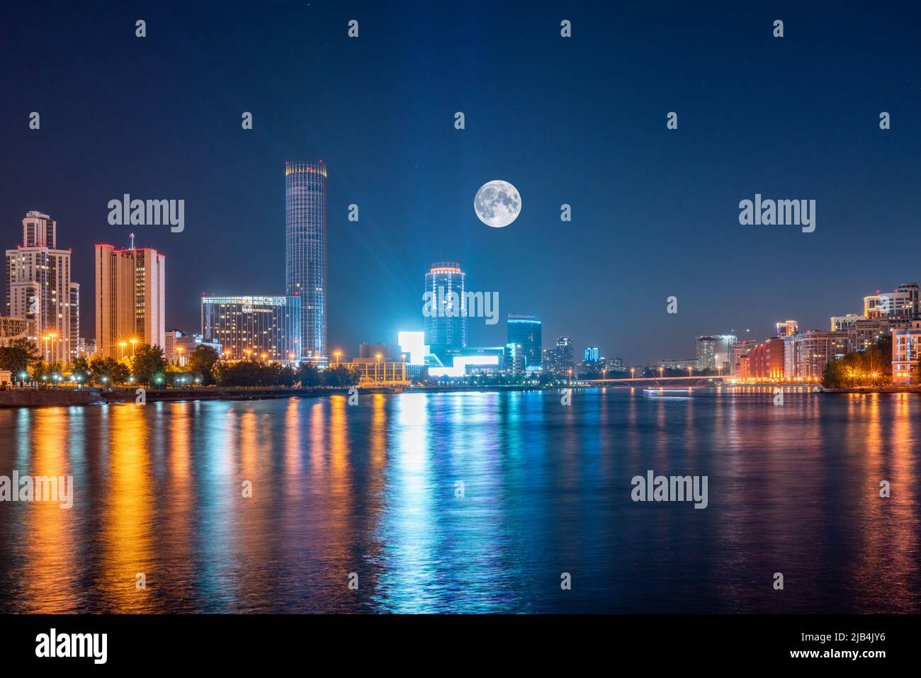 Night with big moon on a pond in the center of the city. Yekaterinburg ...