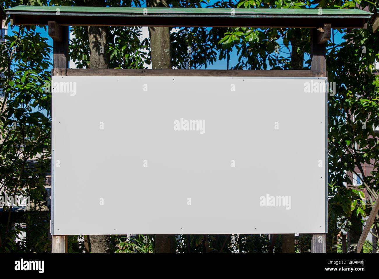 Large blank white board outside in sunny day Stock Photo