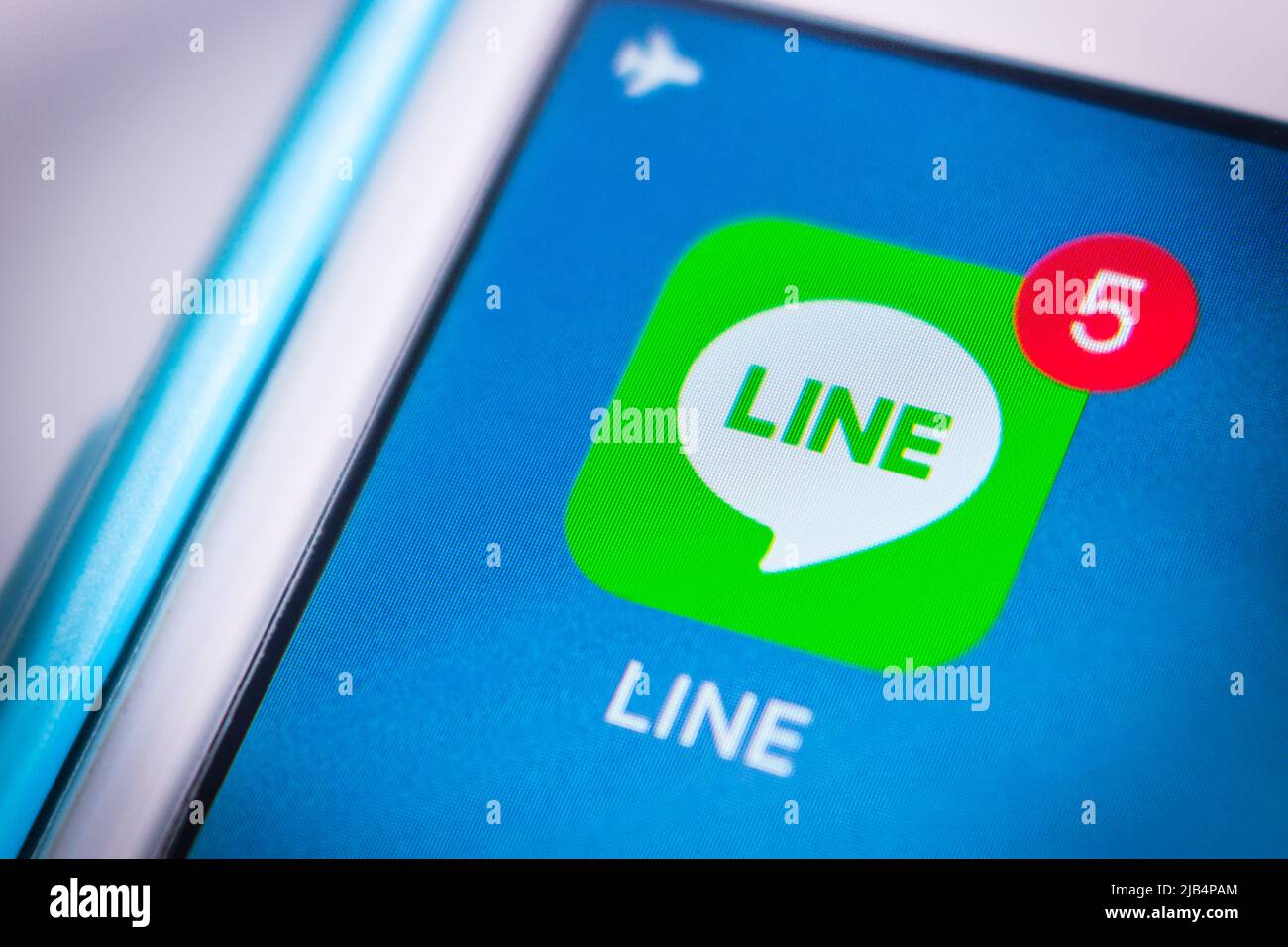 Kumamoto, Japan - Apr 17, 2020 : LINE app with badge 5 on iPhone home screen. LINE is a freeware app for instant communications on electronic devices. Stock Photo
