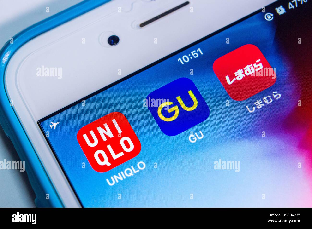 Kumamoto, Japan - Apr 29 2020 : UNIQLO, GU and Shimamura logos on iPhone. Top 3 big giants of Japanese fast fashion industry. Translation : Shimamura Stock Photo