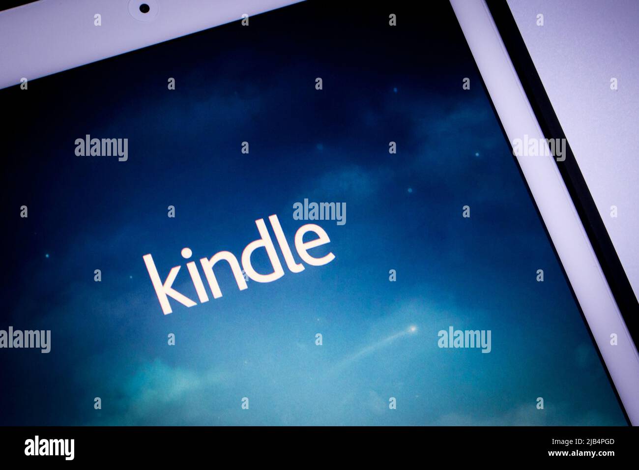 Kindle app, e-book reader by Amazon, on iPad. From Amazon website or Kindle Store, an online e-book store by Amazon, users can purchase an e-book. Stock Photo
